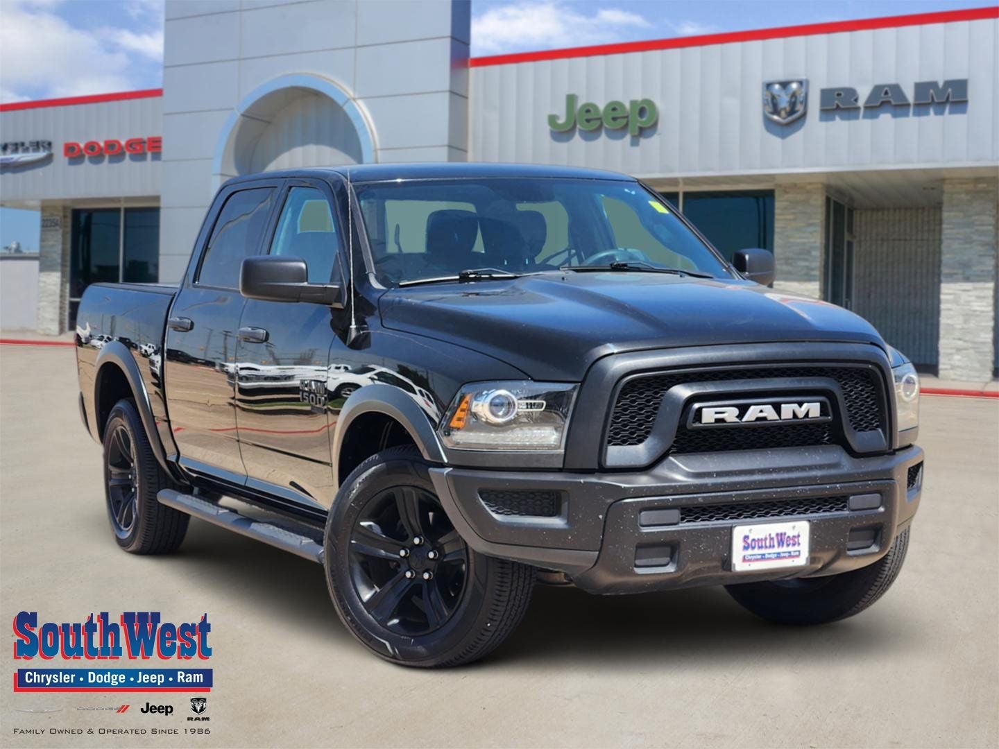 2022 RAM 1500 Classic Warlock Crew Cab 4x4 5'7' Box in Diamond Black Crystal Pearlcoat — front three-quarter view