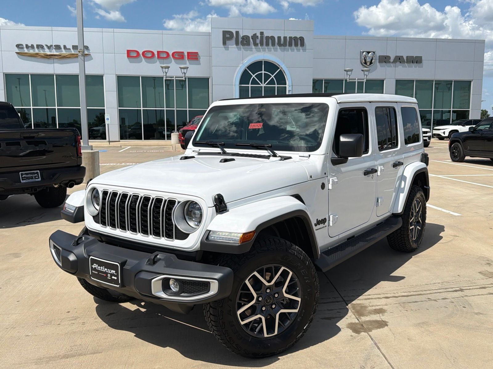 2026 Jeep Wrangler WRANGLER 4-DOOR SAHARA in Bright White Clear-Coat Exterior Paint — front three-quarter view