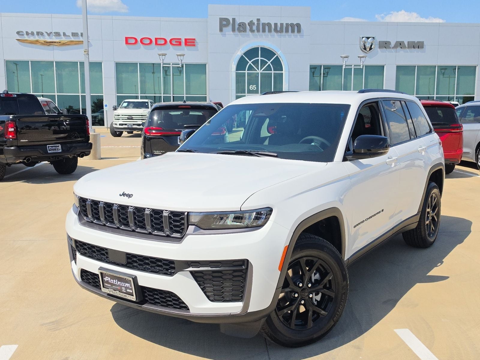 2026 Jeep Grand Cherokee GRAND CHEROKEE LAREDO ALTITUDE 4X2 in Bright White Clear-Coat Exterior Paint — front three-quarter view