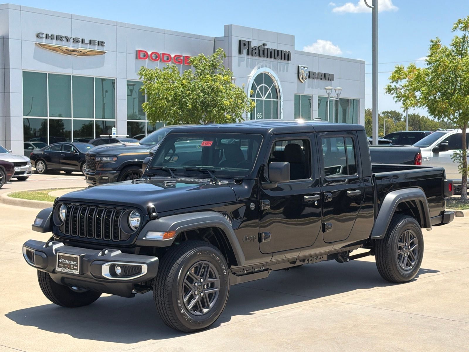 2026 Jeep Gladiator GLADIATOR SPORT 4X4 in Black Clear-Coat Exterior Paint — front three-quarter view