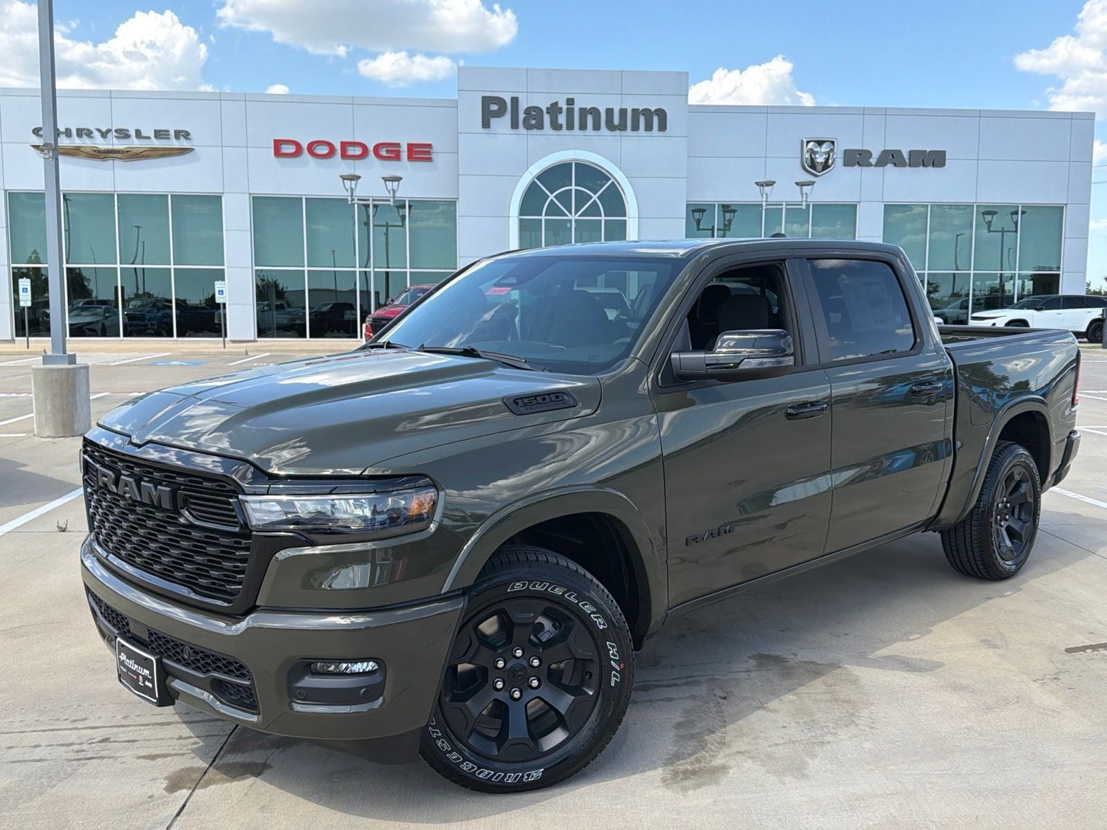2026 RAM Ram 1500 RAM 1500 BIG HORN CREW CAB 4X4 5'7' BOX in Tank Exterior Paint — front three-quarter view