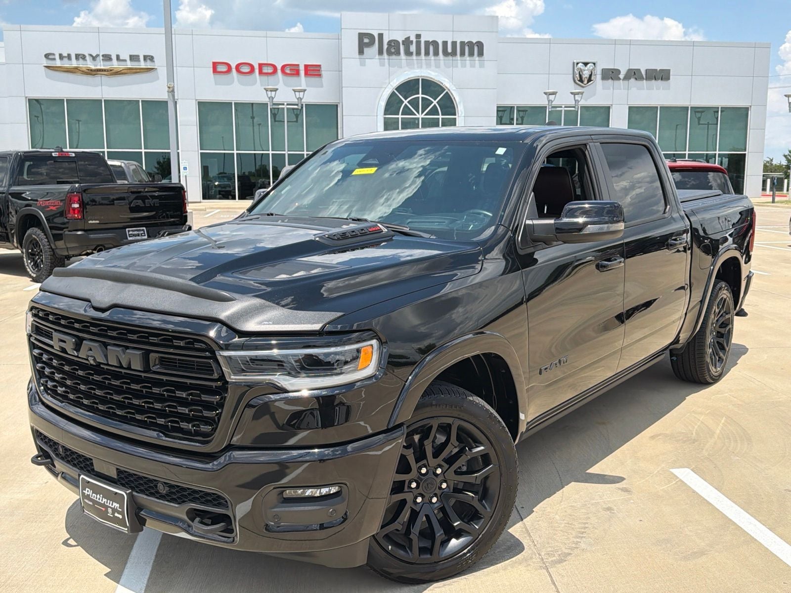 2025 RAM Ram 1500 Limited Crew Cab 4x4 5'7' Box in Diamond Black Crystal Pearlcoat — front three-quarter view