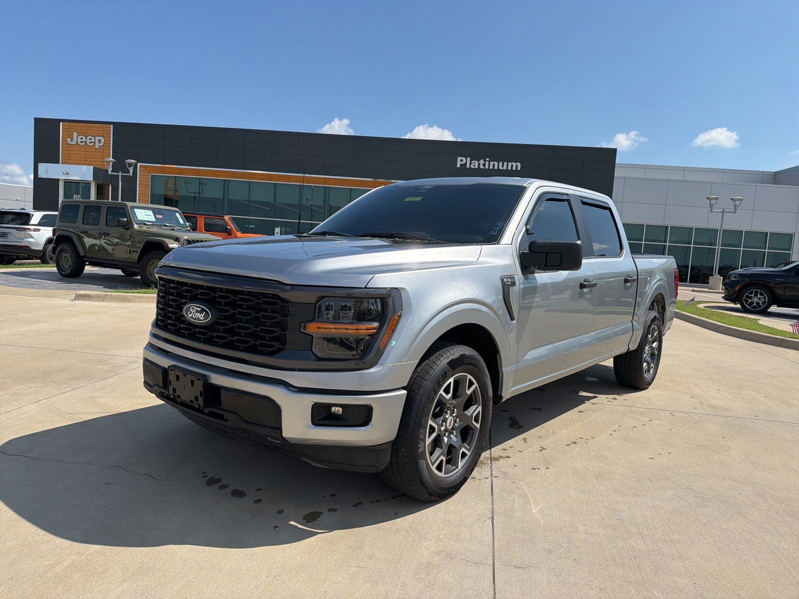 2024 Ford F-150 STX in Silver Metallic — front three-quarter view