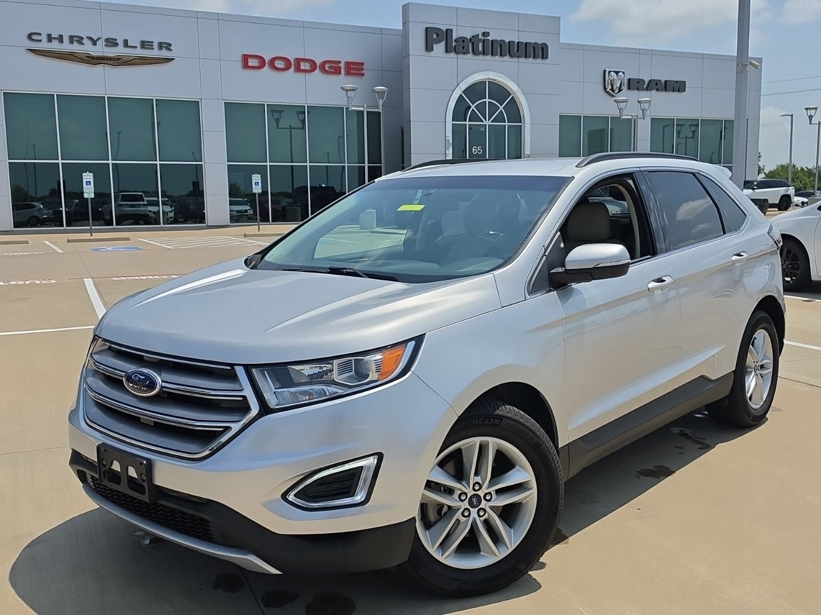 2018 Ford Edge SEL in Ingot Silver — front three-quarter view
