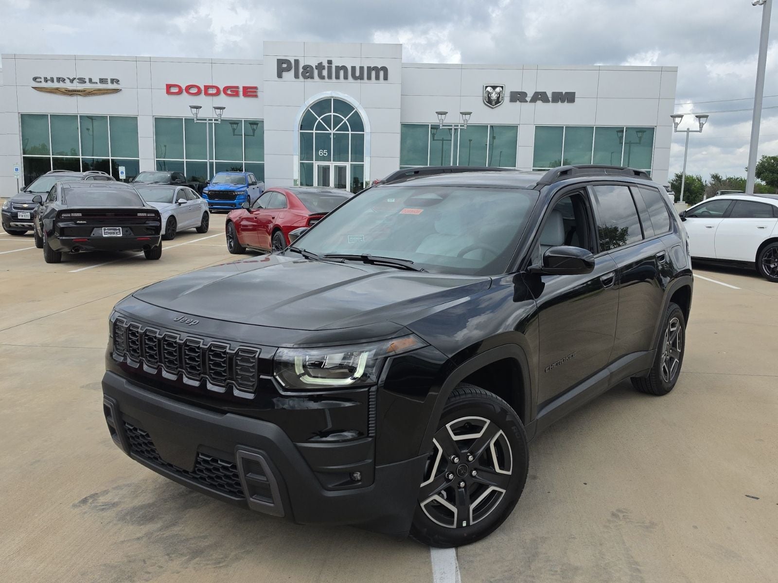 2026 Jeep Cherokee CHEROKEE LAREDO 4X4 in Diamond Black Crystal Pearl-Coat Exterior Paint — front three-quarter view