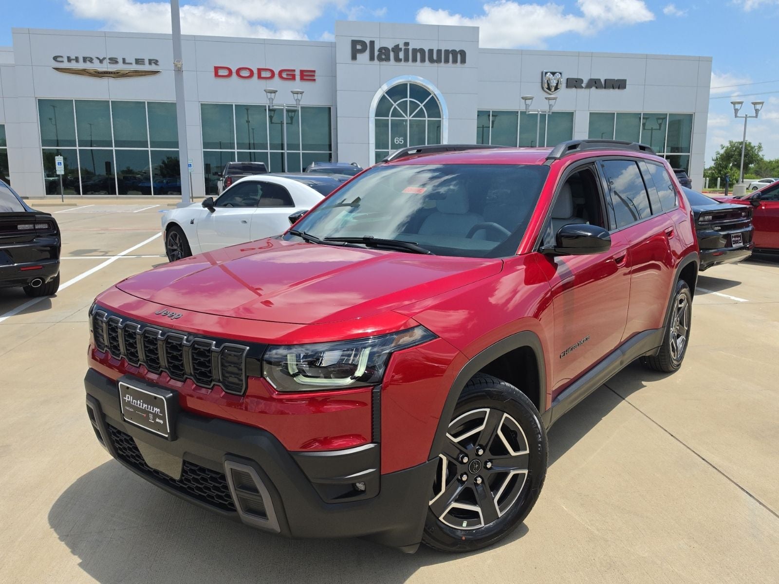 2026 Jeep Cherokee CHEROKEE LAREDO 4X4 in Red Hot Pearl-Coat Exterior Paint — front three-quarter view