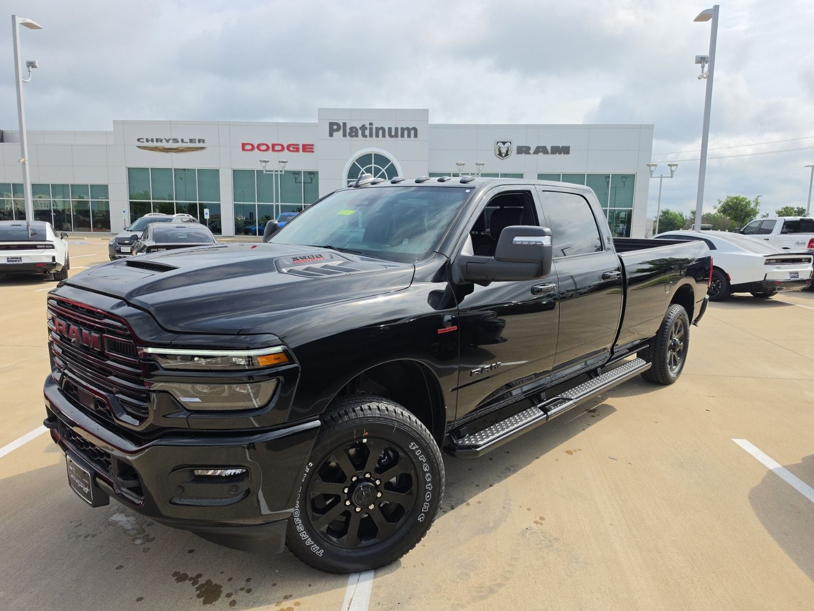 2026 RAM Ram 3500 RAM 3500 LARAMIE CREW CAB 4X4 8' BOX in Diamond Black Crystal Pearl-Coat Exterior Paint — front three-quarter view