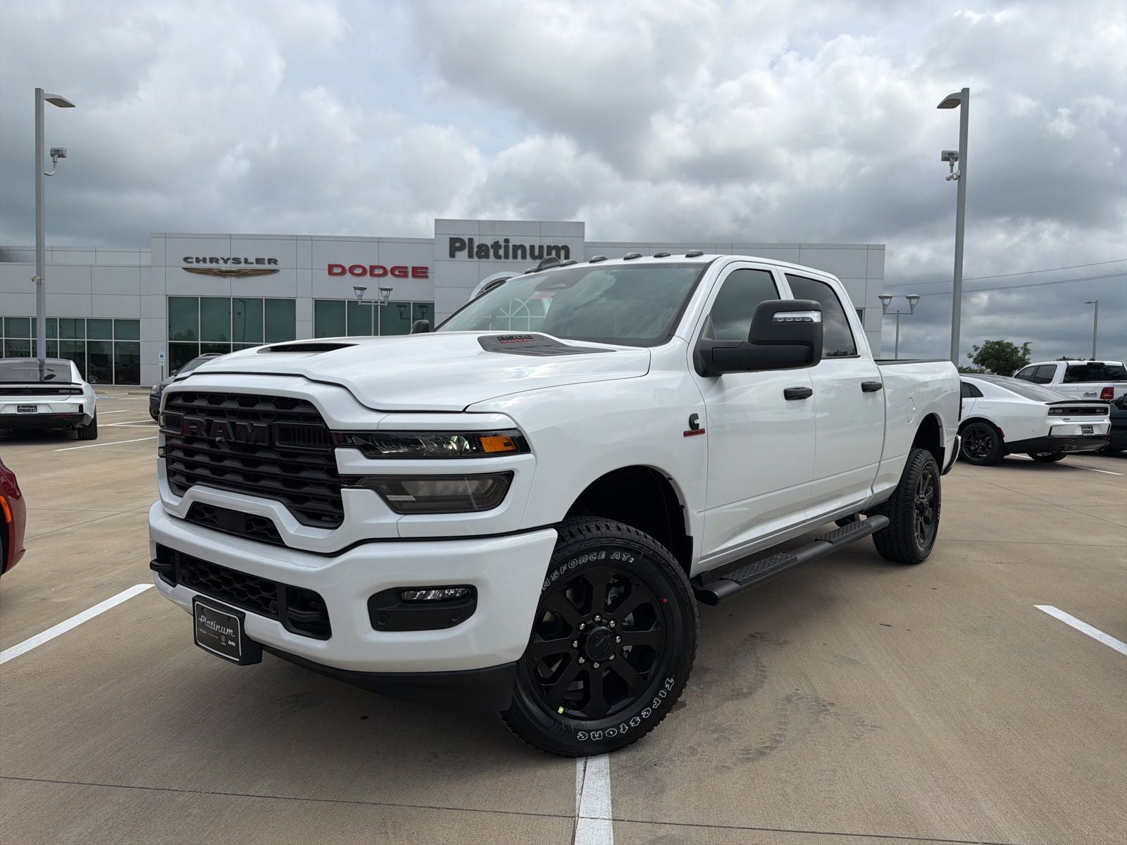 2026 RAM Ram 2500 RAM 2500 BLACK EXPRESS CREW CAB 4X4 6'4' BOX in Bright White Clear-Coat Exterior Paint — front three-quarter view