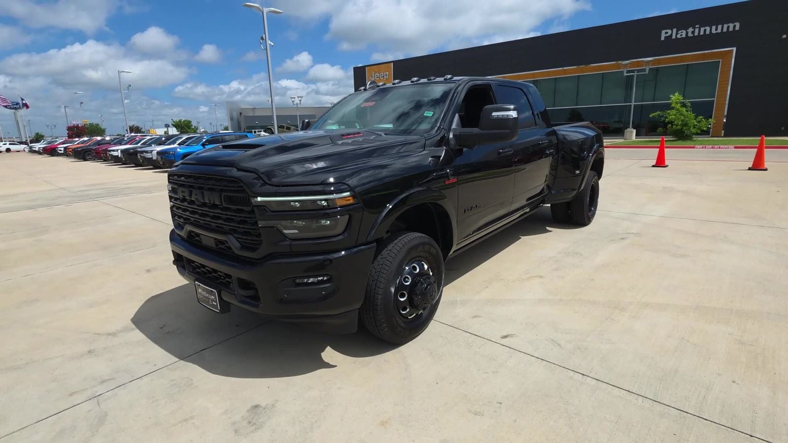 2026 RAM Ram 3500 RAM 3500 LIMITED MEGA CAB 4X4 6'4' BOX in Diamond Black Crystal Pearl-Coat Exterior Paint — front three-quarter view