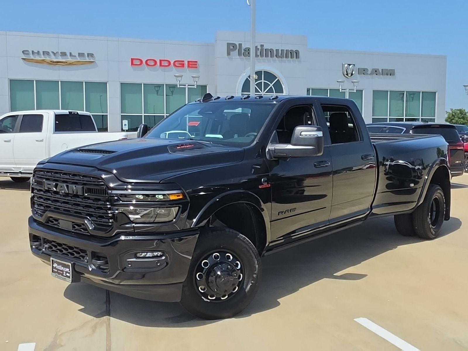 2026 RAM Ram 3500 RAM 3500 LIMITED CREW CAB 4X4 8' BOX in Diamond Black Crystal Pearl-Coat Exterior Paint — front three-quarter view