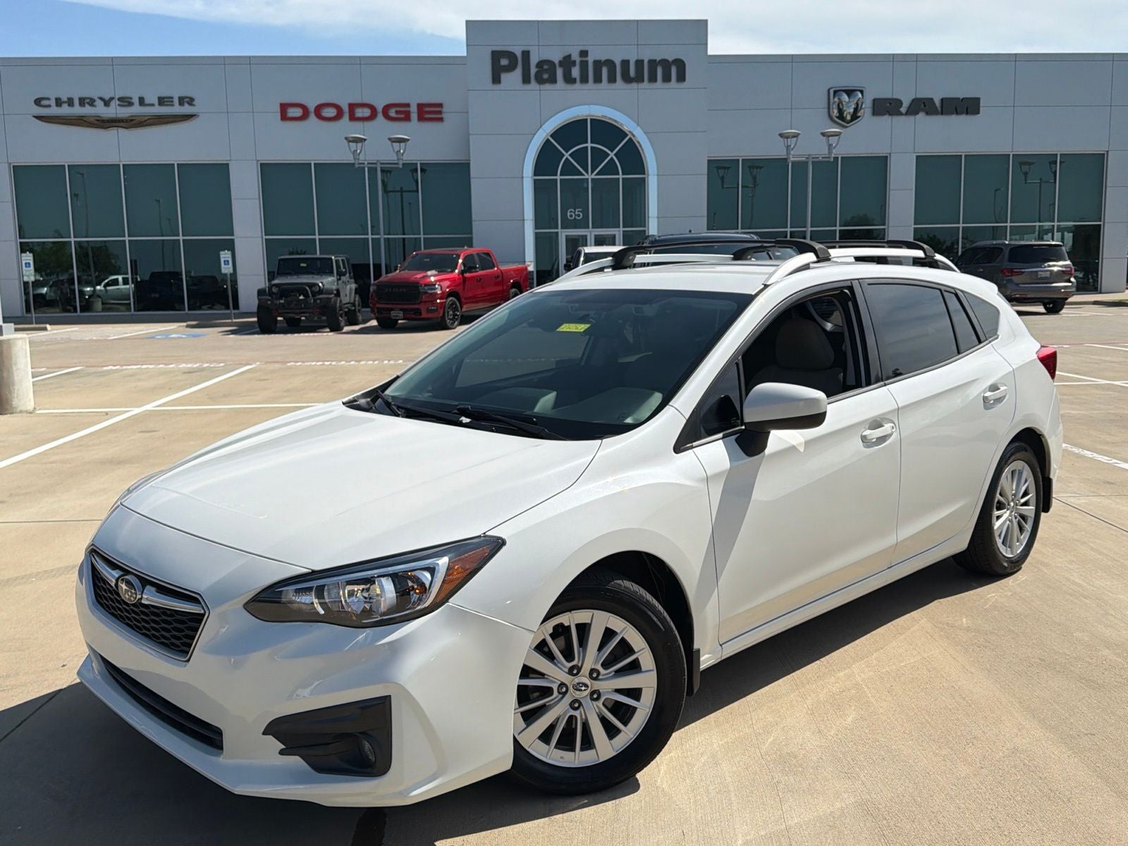 2017 Subaru Impreza 2.0i Premium in Crystal White Pearl — front three-quarter view