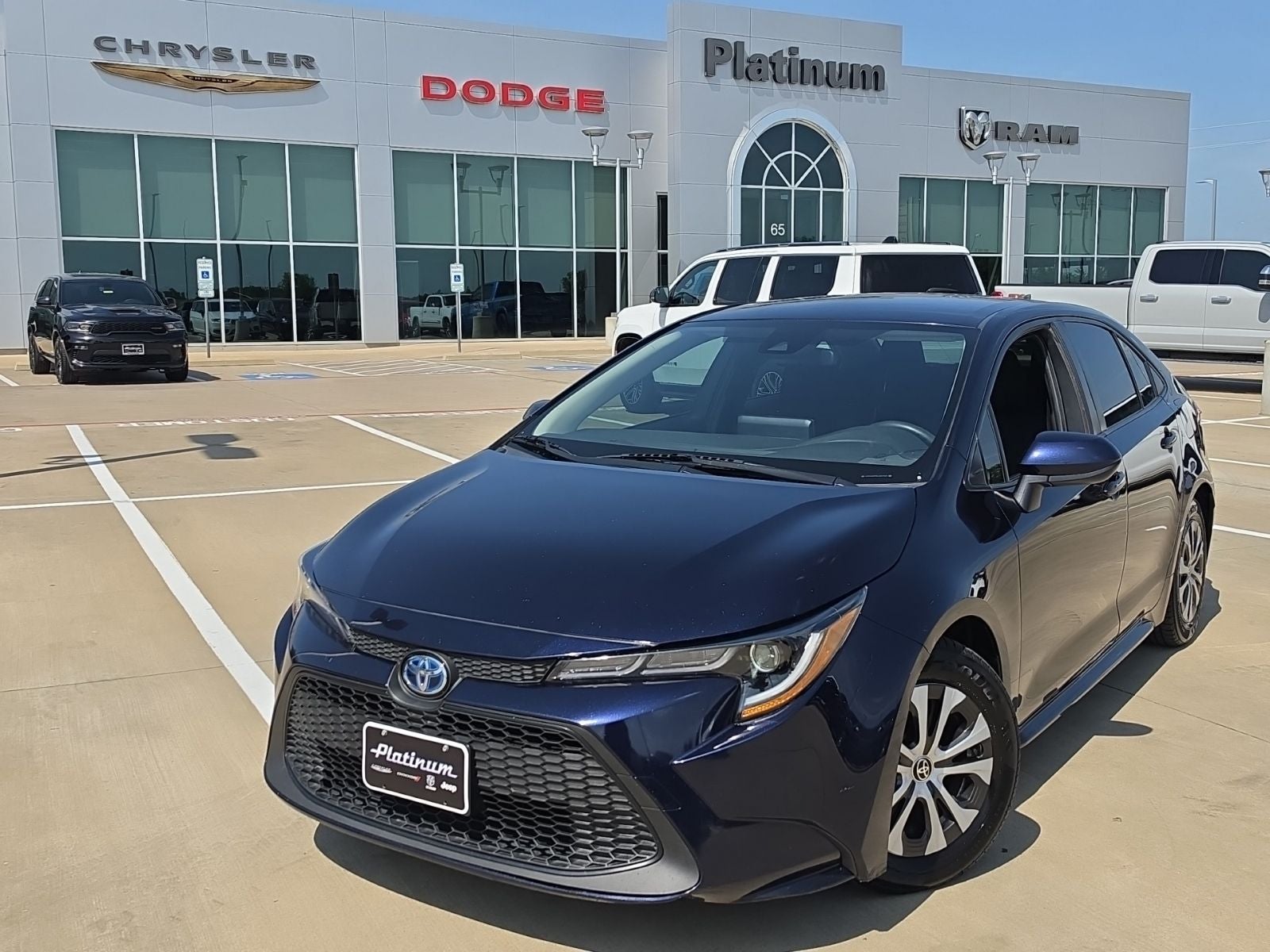 2022 Toyota Corolla Hybrid LE in Blueprint — front three-quarter view