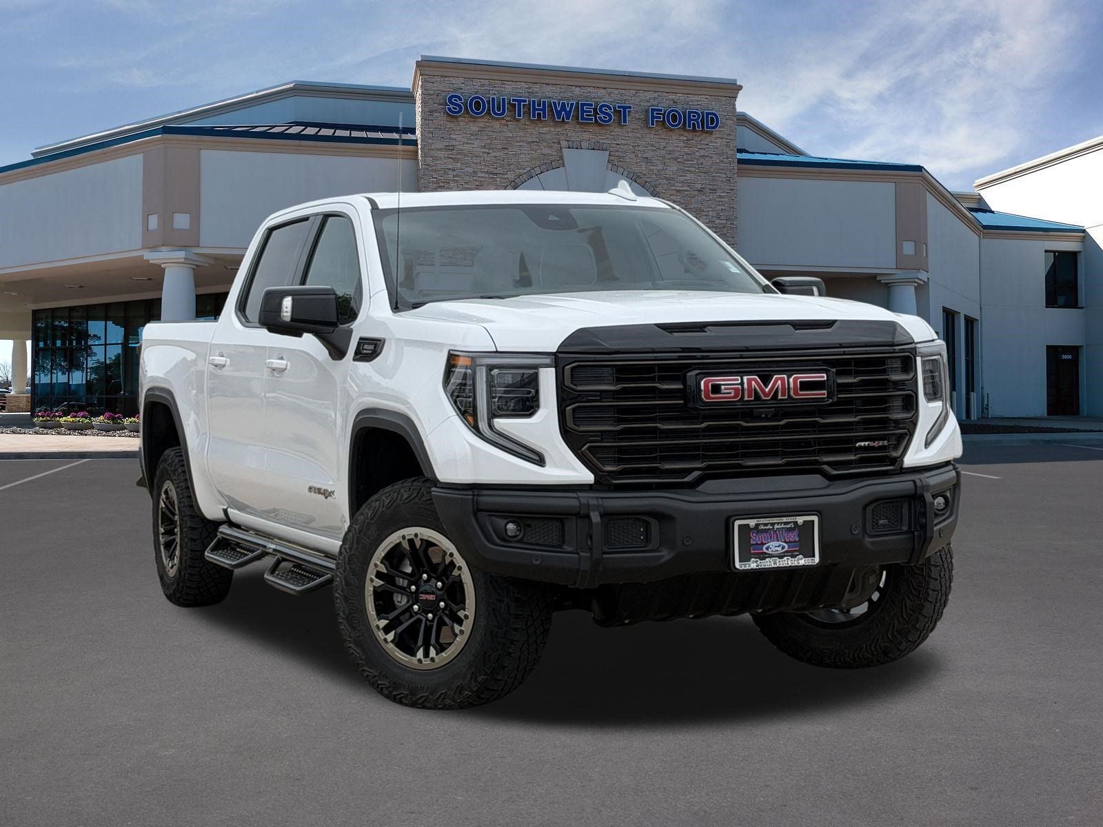 2024 GMC Sierra 1500 AT4X in Summit White — front three-quarter view