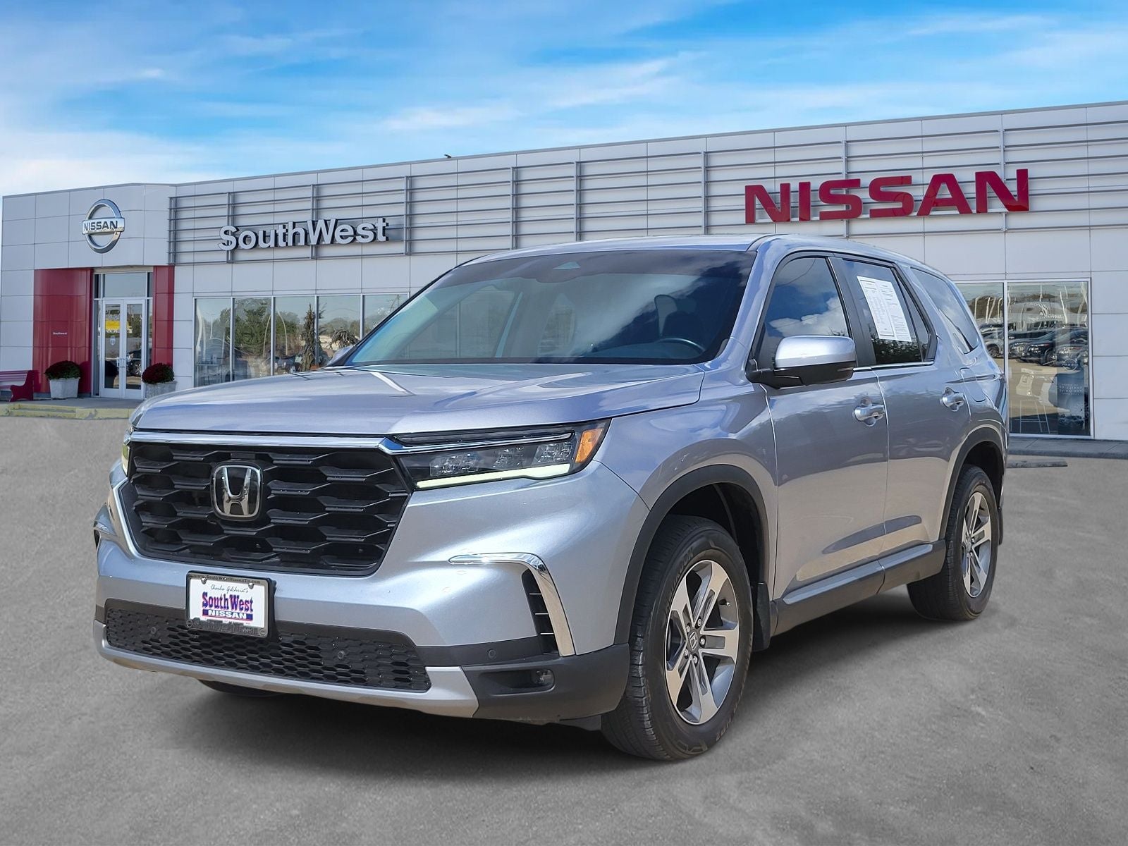 2024 Honda Pilot EX-L 8 Passenger in Silver — front three-quarter view