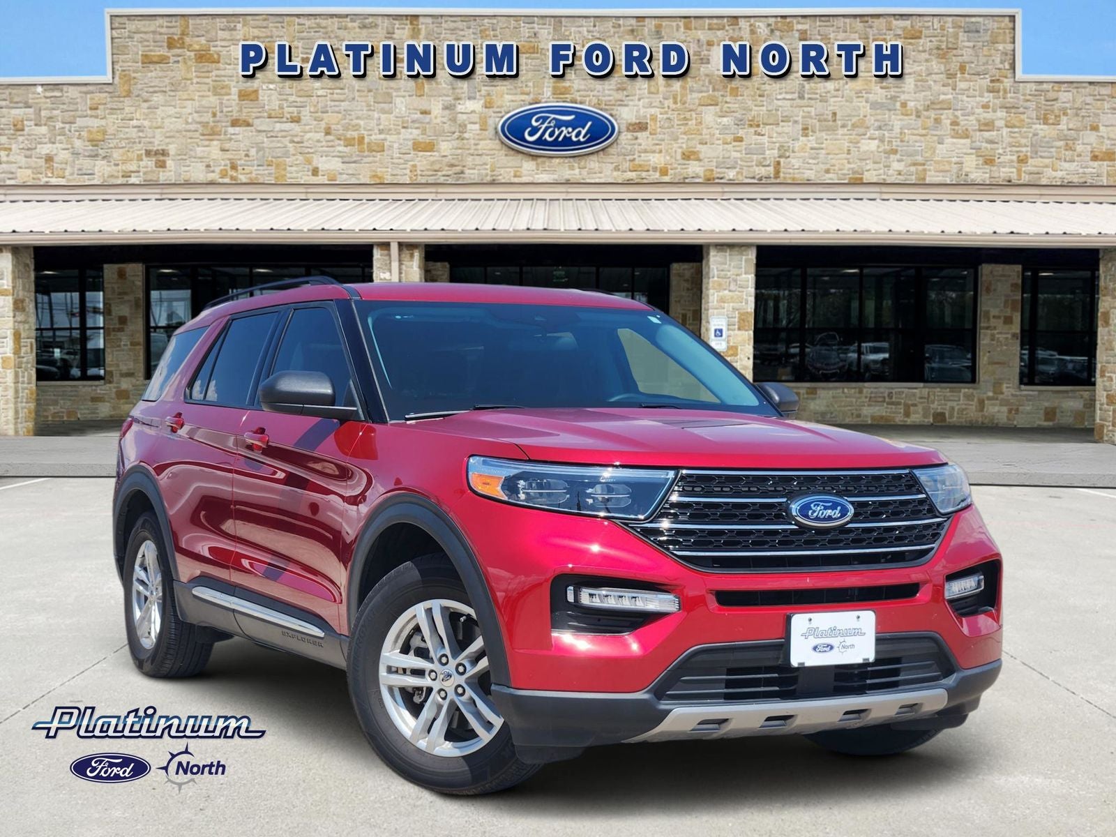 2024 Ford Explorer XLT in Rapid Red Metallic Tinted Clearcoat — front three-quarter view