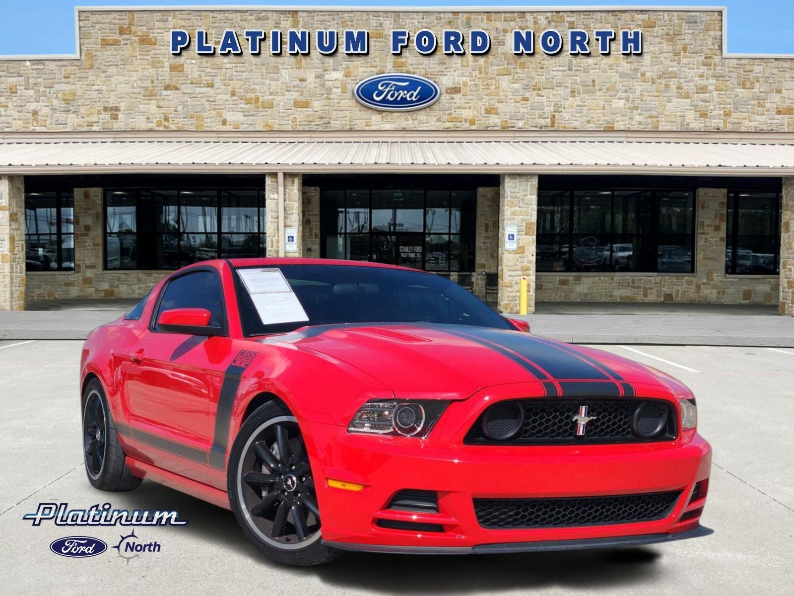 2013 Ford Mustang Boss 302 in Race Red — front three-quarter view