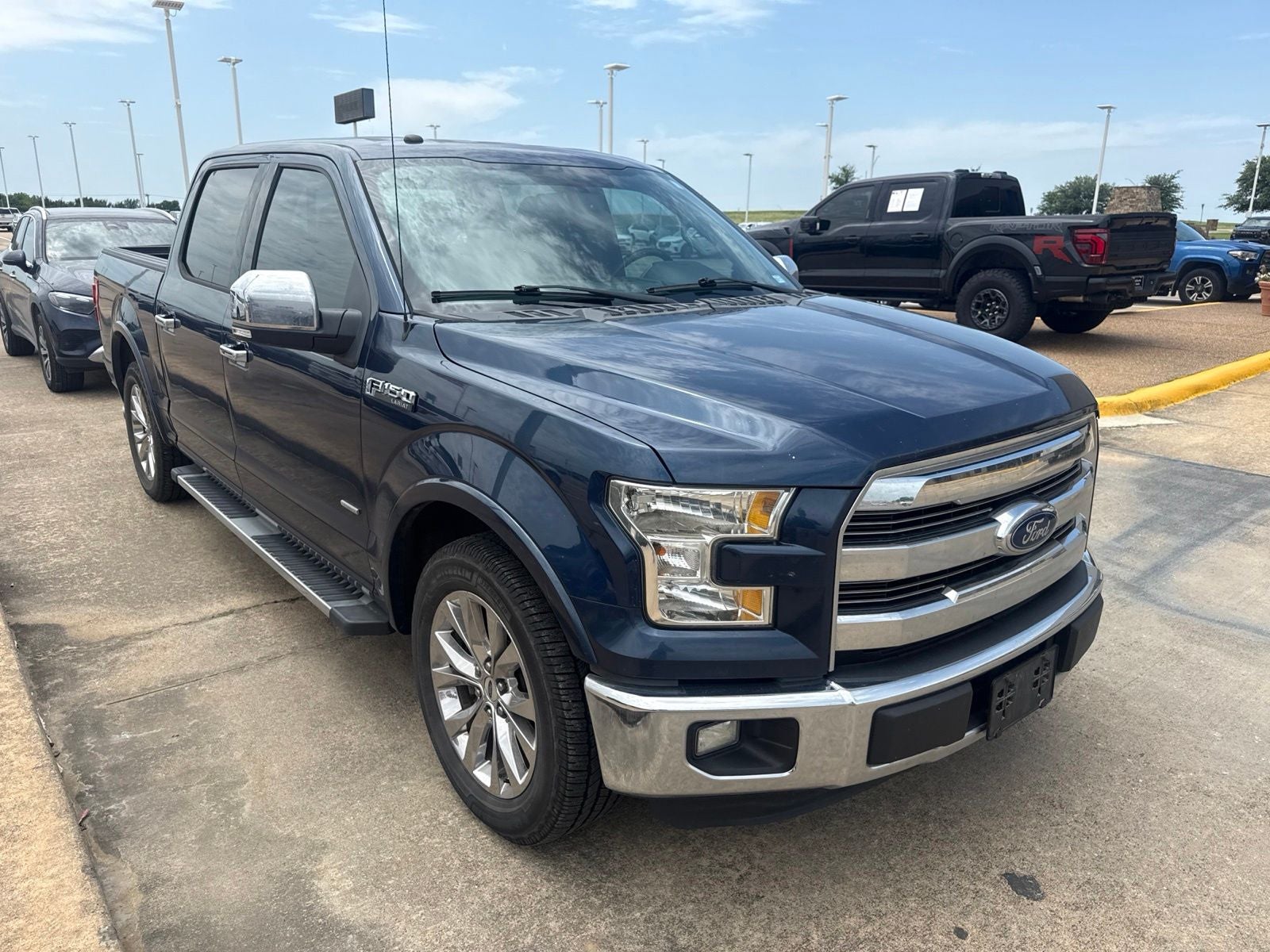 2016 Ford F-150 Lariat in Blue — front three-quarter view