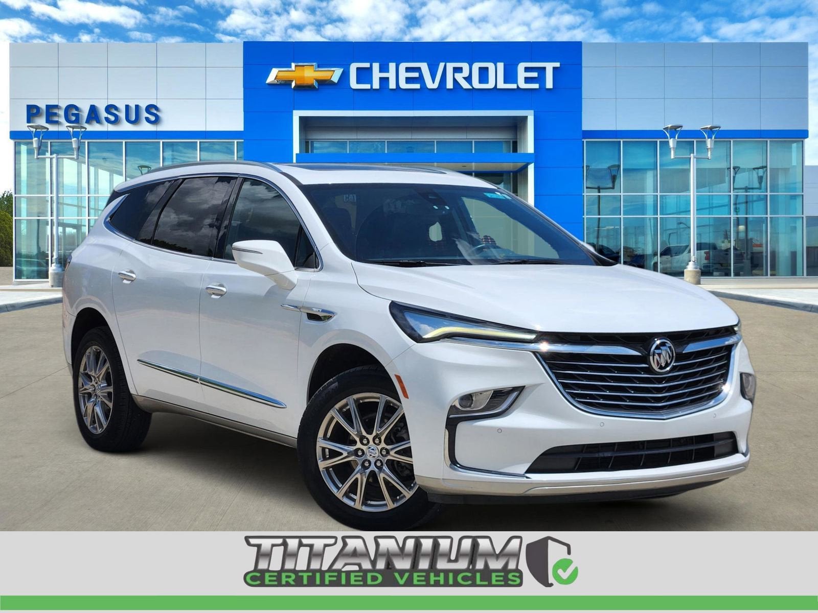 2023 Buick Enclave Essence in Summit White — front three-quarter view