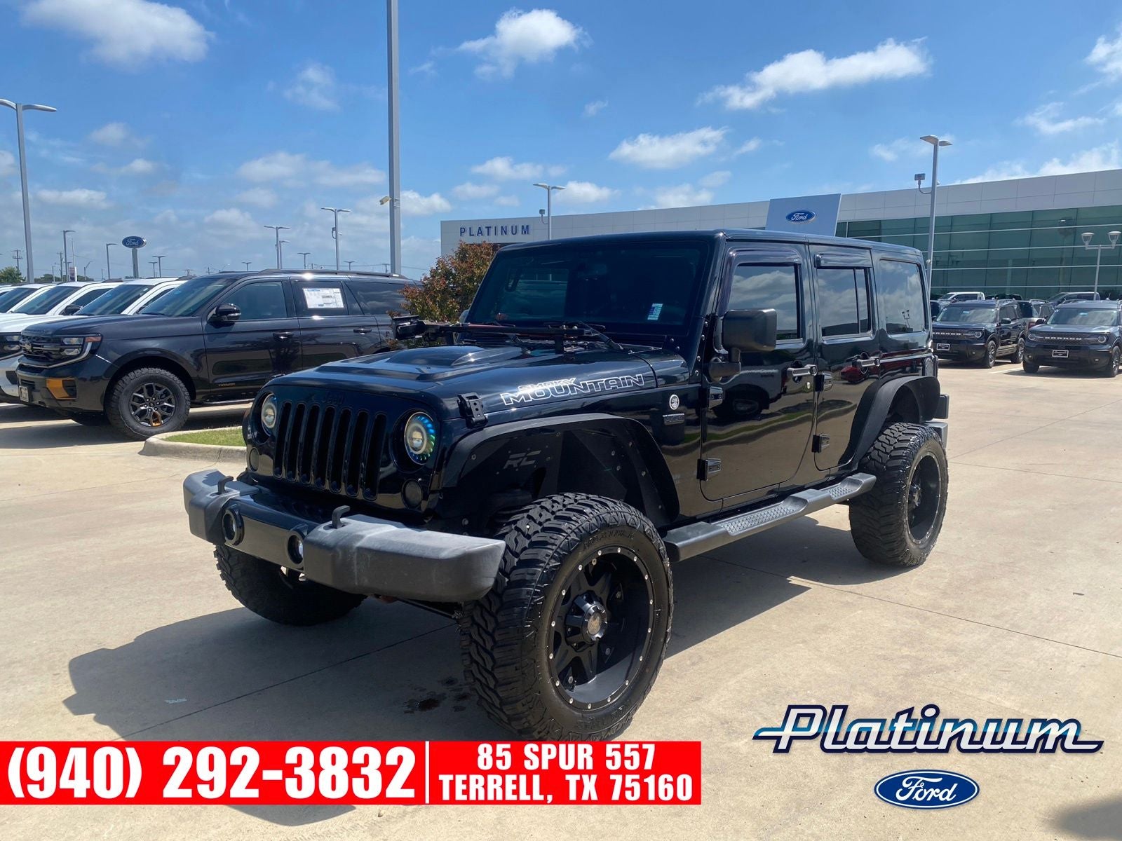 2017 Jeep Wrangler Unlimited Sahara in Black Clearcoat — front three-quarter view
